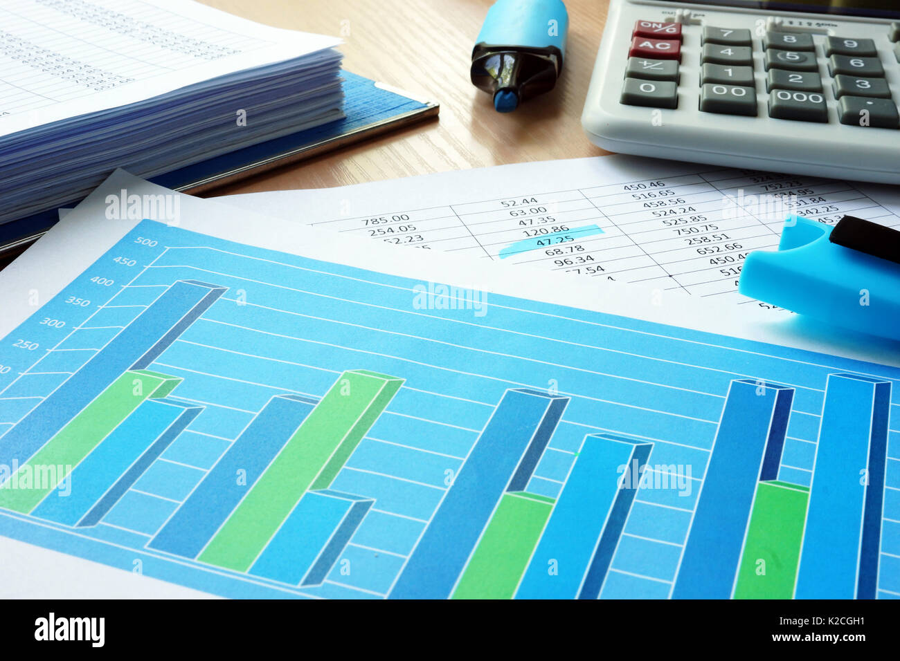 Business analytics with graphs and financial documents. Stock Photo
