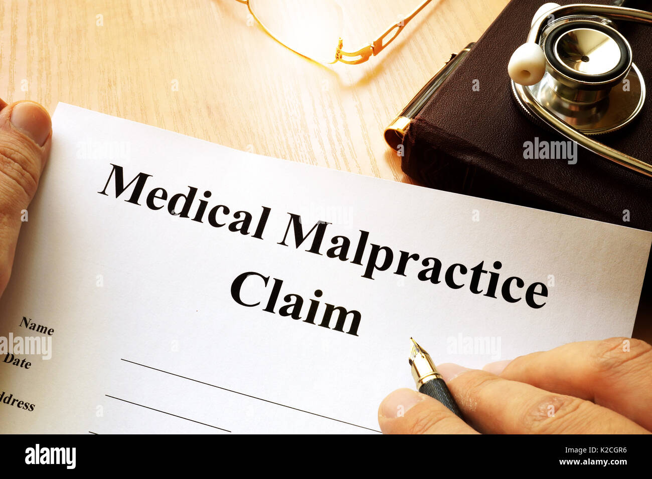 Medical Malpractice Claim on a table. Stock Photo