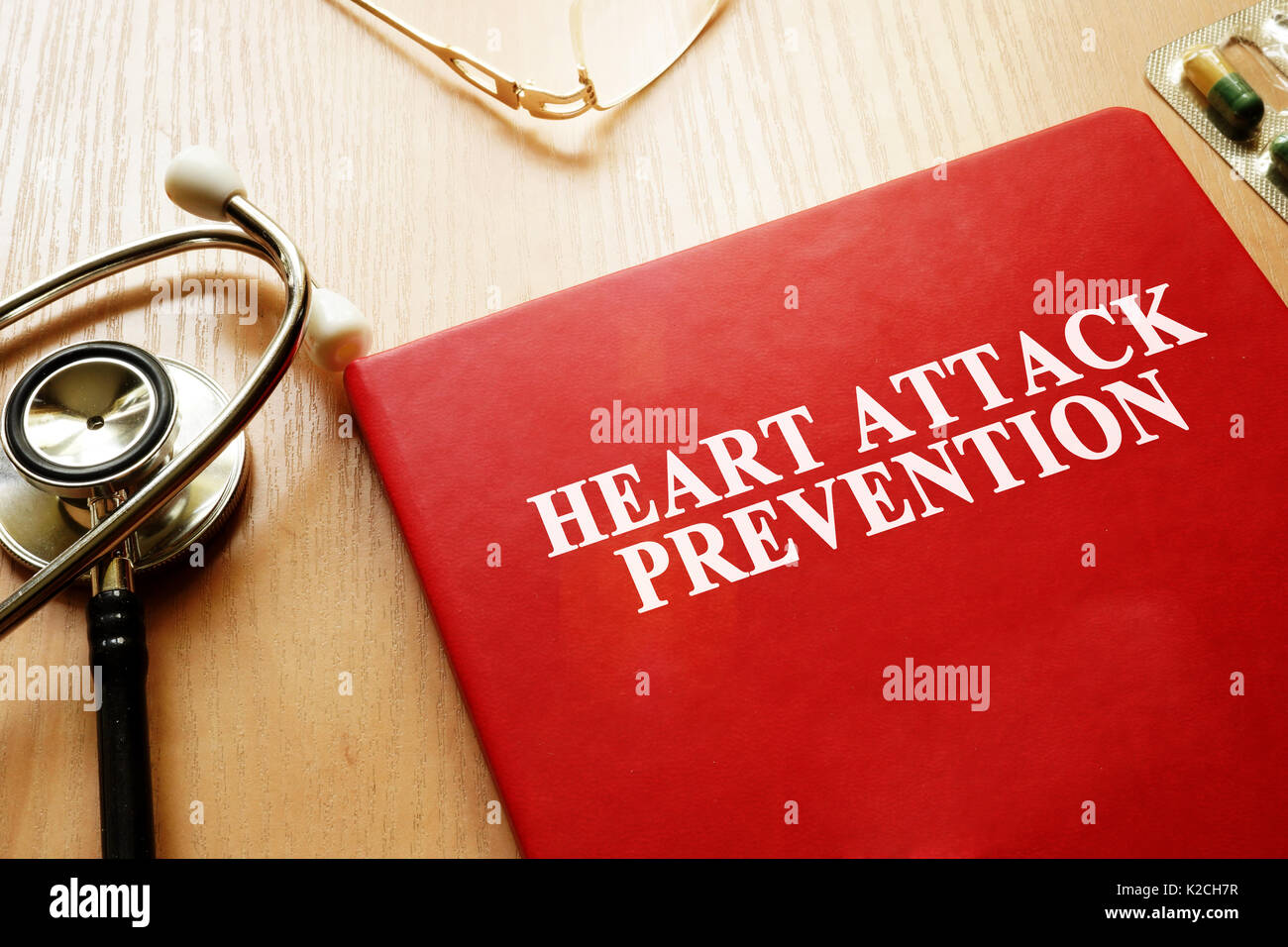 Heart Attack Prevention book on a table. Stock Photo