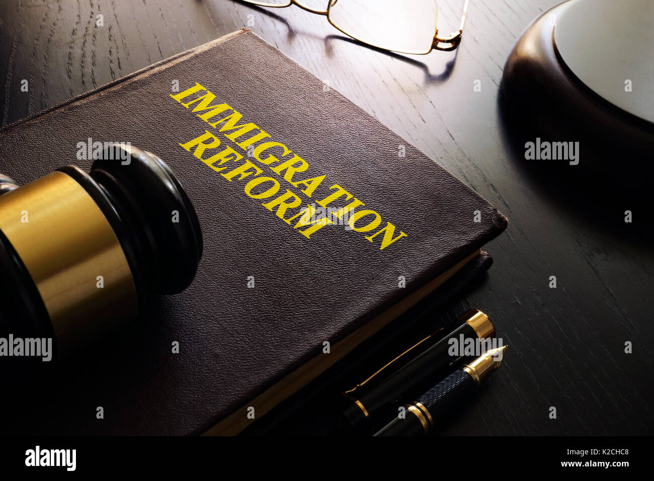 Book with title Immigration reform on a table. Stock Photo