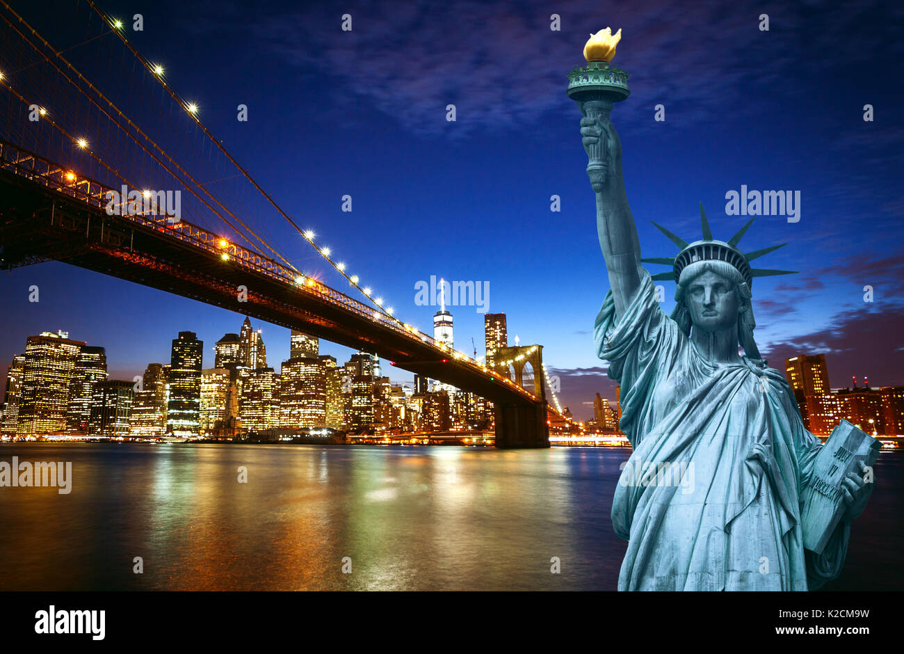 Spectacular view of Manhattan by night with Liberty Statue Stock Photo