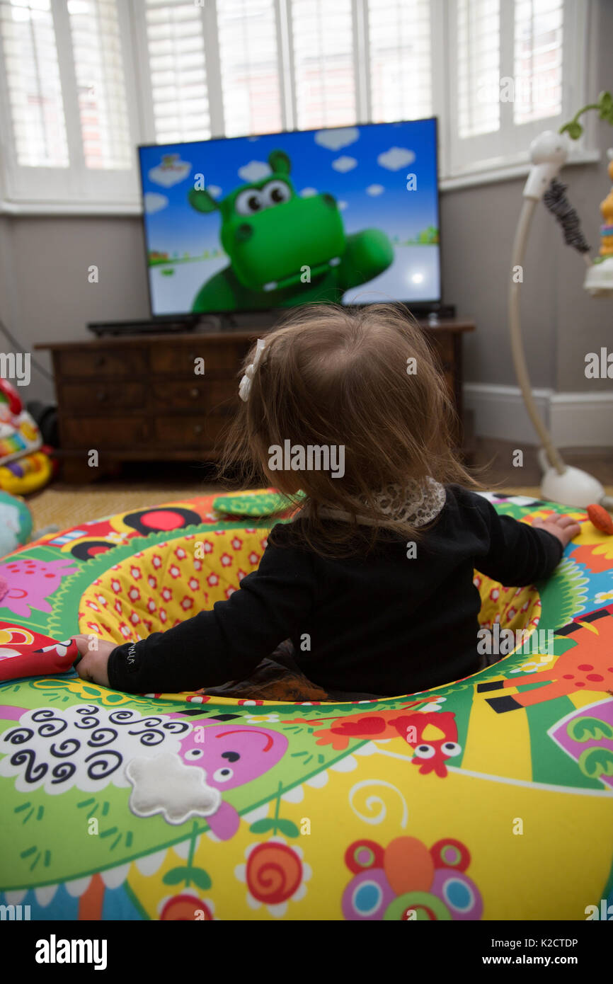 8 moth old baby watching TV Stock Photo Alamy