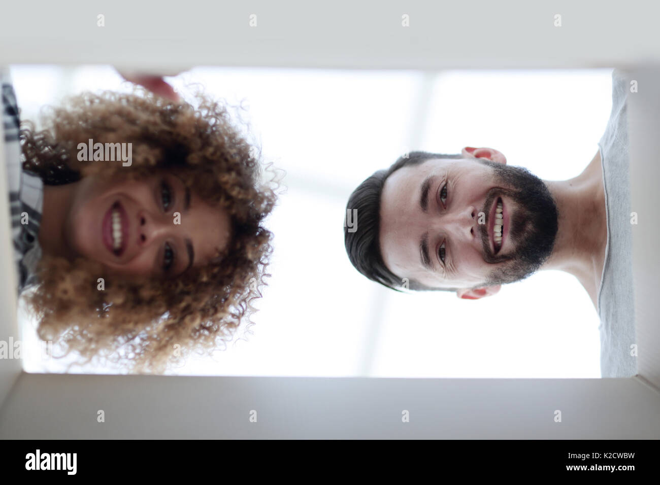 View from the bottom of the newlyweds looking inside the box. Stock Photo