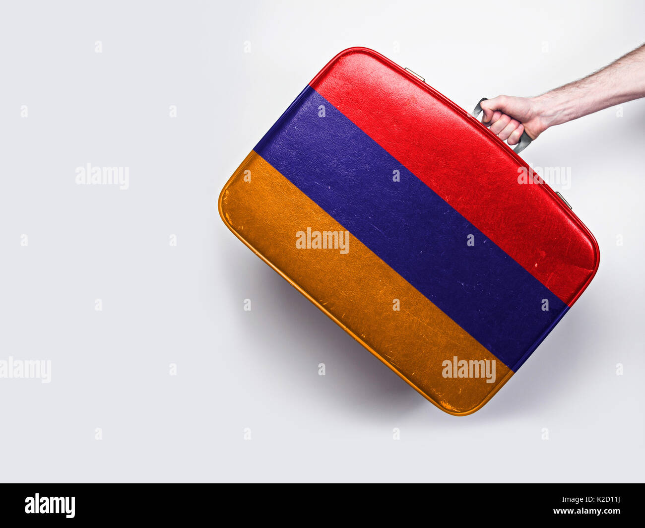 Armenia flag on a vintage leather suitcase Stock Photo - Alamy