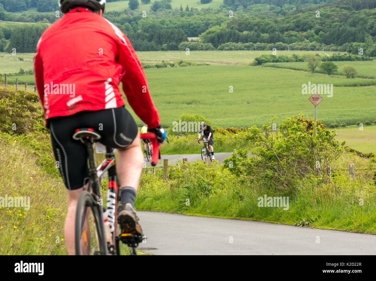 Cyclists cycling up and down Dreva Hill, Cycle Law Scotland Skinny Tweed 2017 cycling event, Peebles, Scottish Borders, Scotland, UK Stock Photo