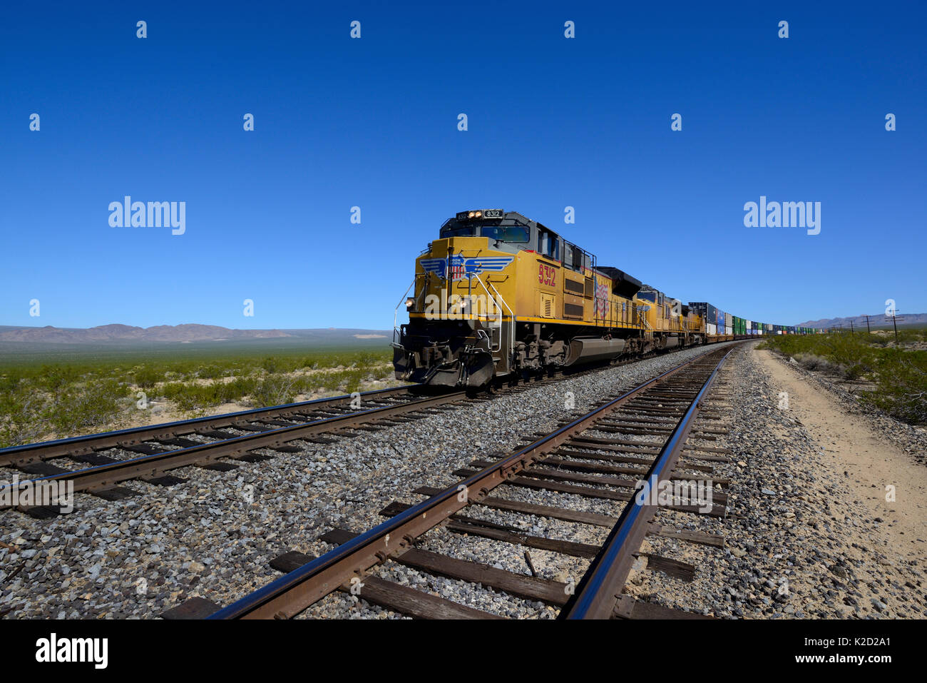 Freight train driving along Union Pacific Railroad, Mohave National Preserve, California, October 2013. Stock Photo
