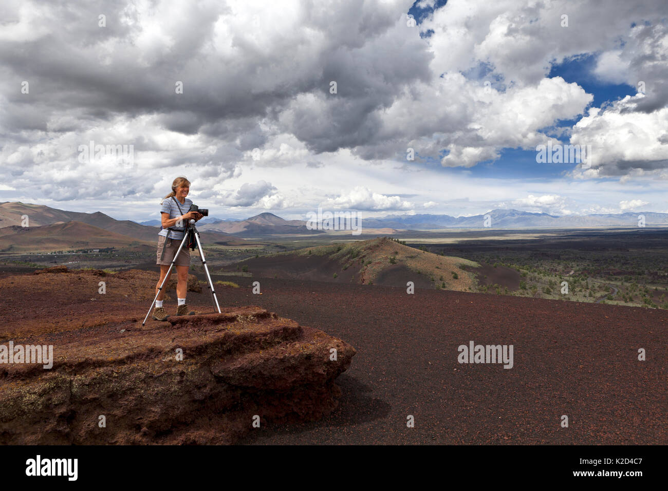 Vicky Spring taking photographs of the wilderness trail on Inferno Cone, in Craters Of The Moon National Monument, Idaho, USA 2015. July. Model released. Stock Photo