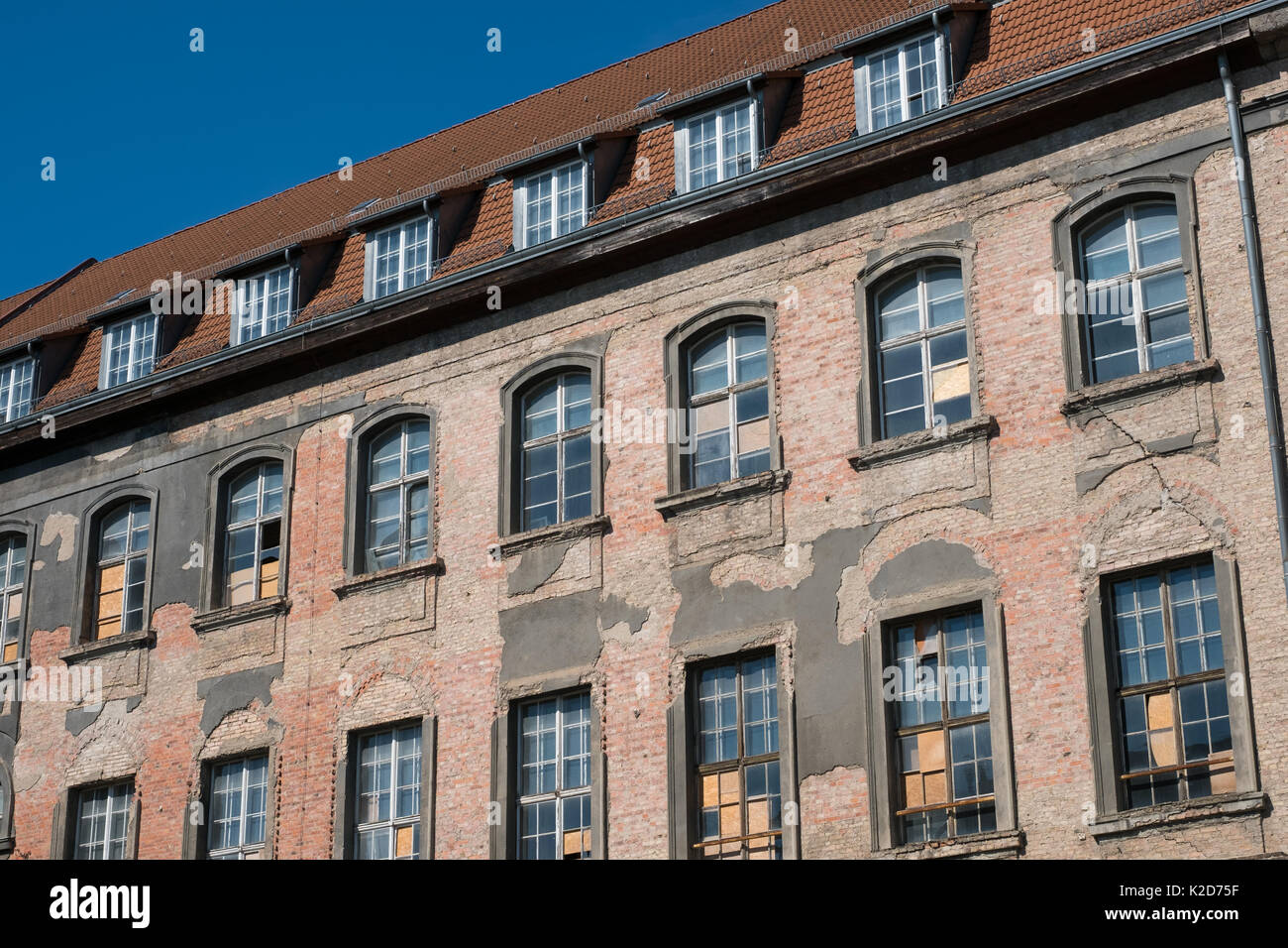old building facade in Berlin before restoration  - damaged facade Stock Photo