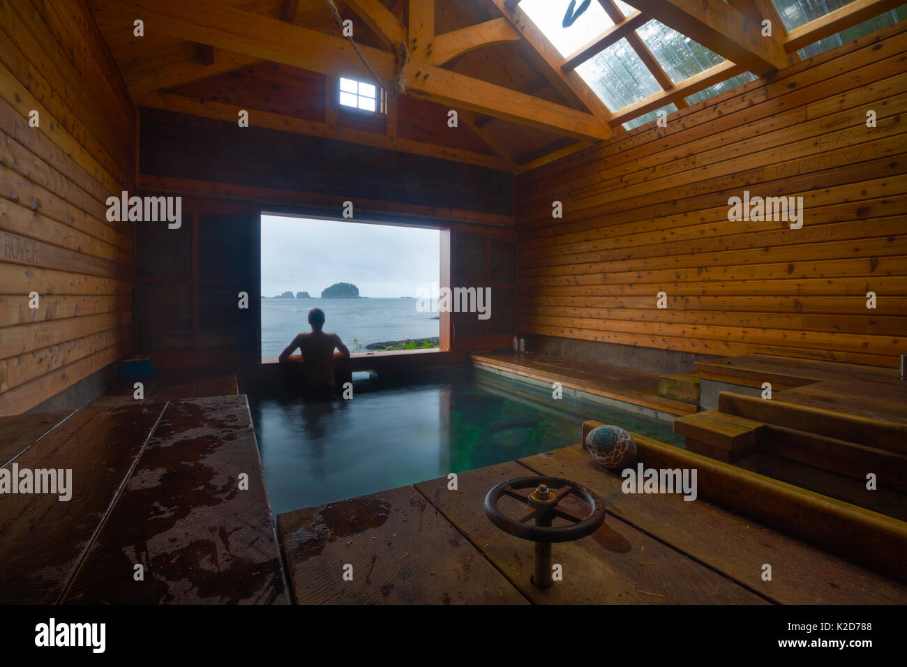 Person in White sulphur hotsprings, Chichagof island, South East Alaska, USA, July. model released Stock Photo