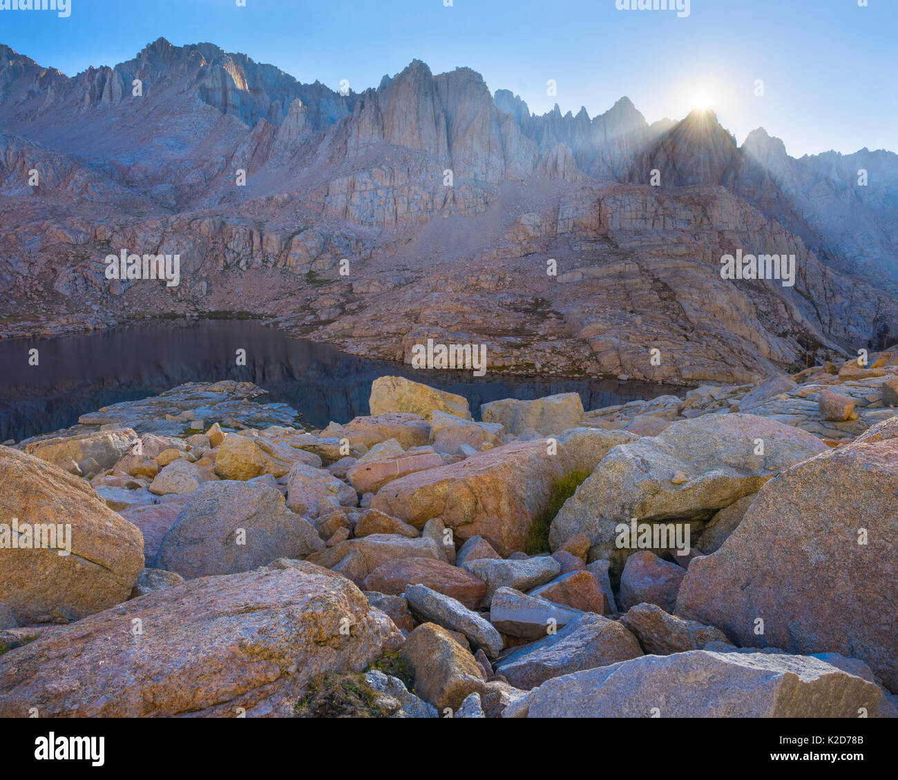 The first rays of sunshine above the Sierra Crest, illuminating granite, Mitre Basin, Sierra Nevada, Sequoia National Park, California, USA, August Stock Photo