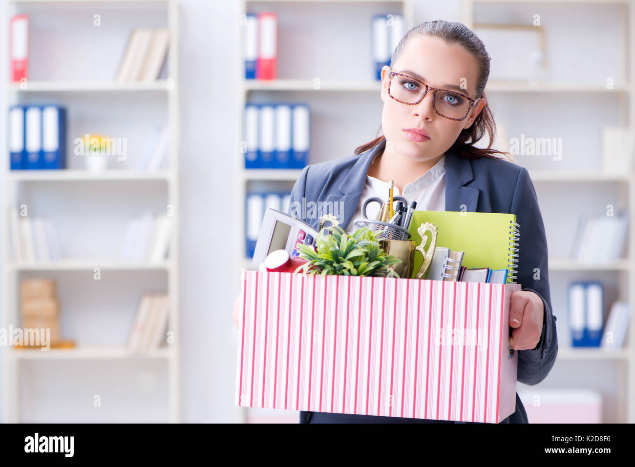 Businesswoman resigning from her job Stock Photo
