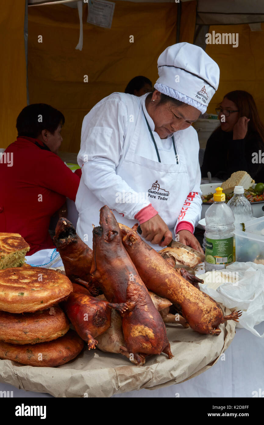 Cuy (roasted Guinea Pig) at food stall, San Francisco Plaza, Cusco, Peru, South America Stock Photo