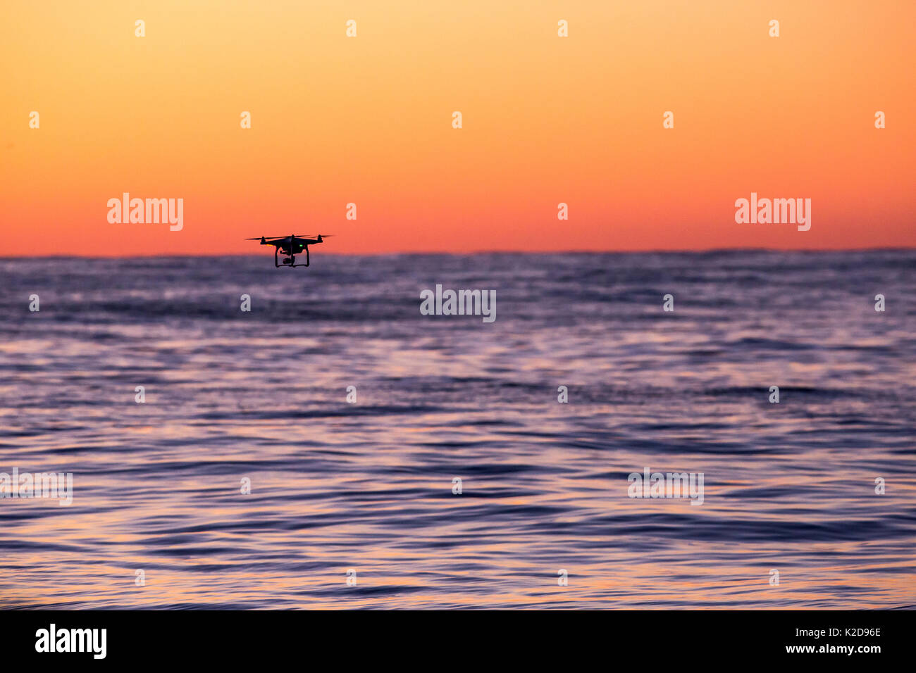 Drone flying over sea at dusk, Andenes, Andoya island, North Atlantic Ocean, Norway, January 2016 Stock Photo