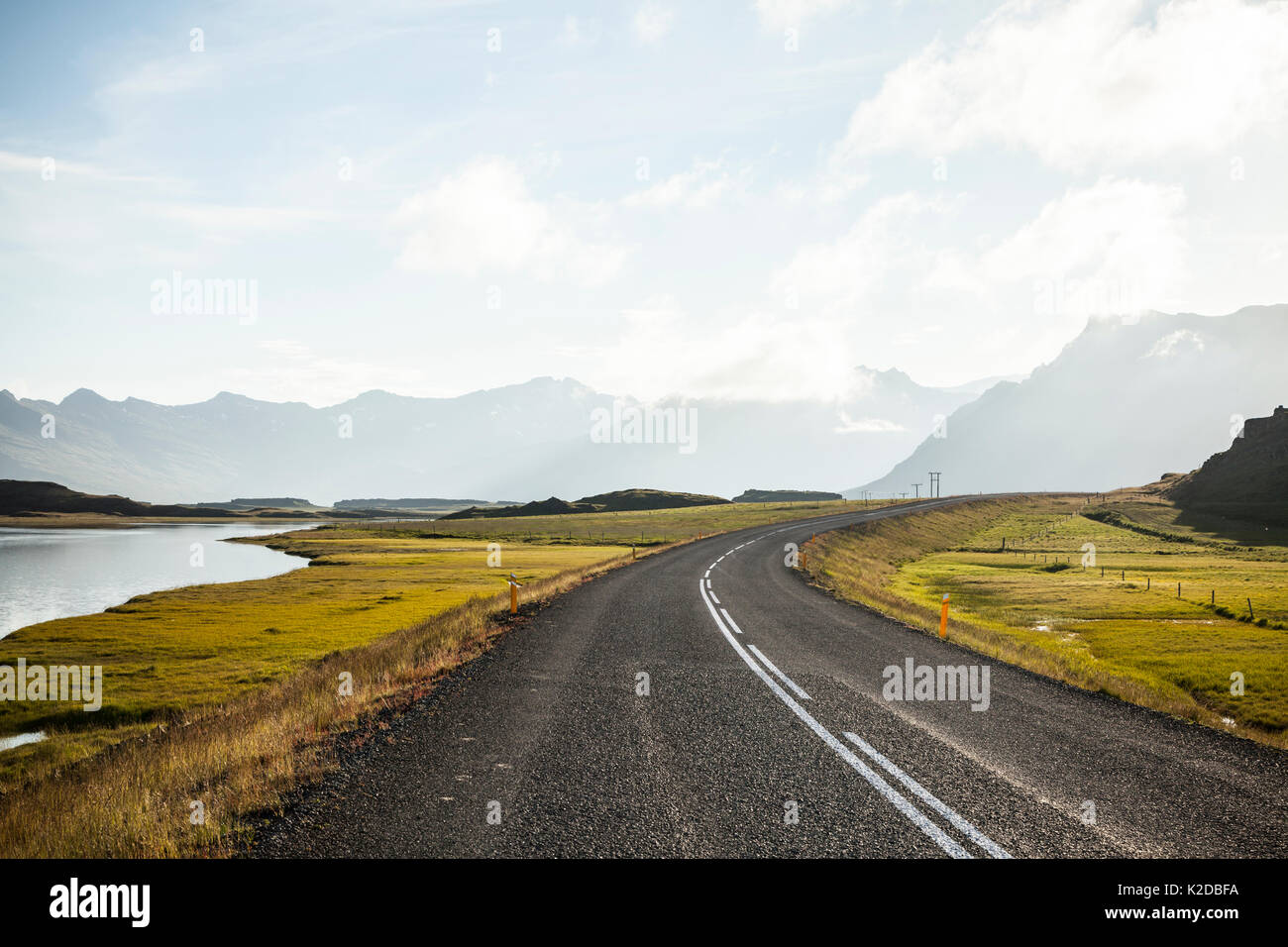 Road in Iceland with moutnains in the background, Iceland, July 2012. Stock Photo