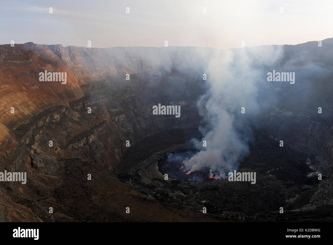 Steam rising from active lava lake in the crater of Nyiragongo Volcano, Virunga National Park, North Kivu Province, Democratic Republic of Congo, Africa Stock Photo