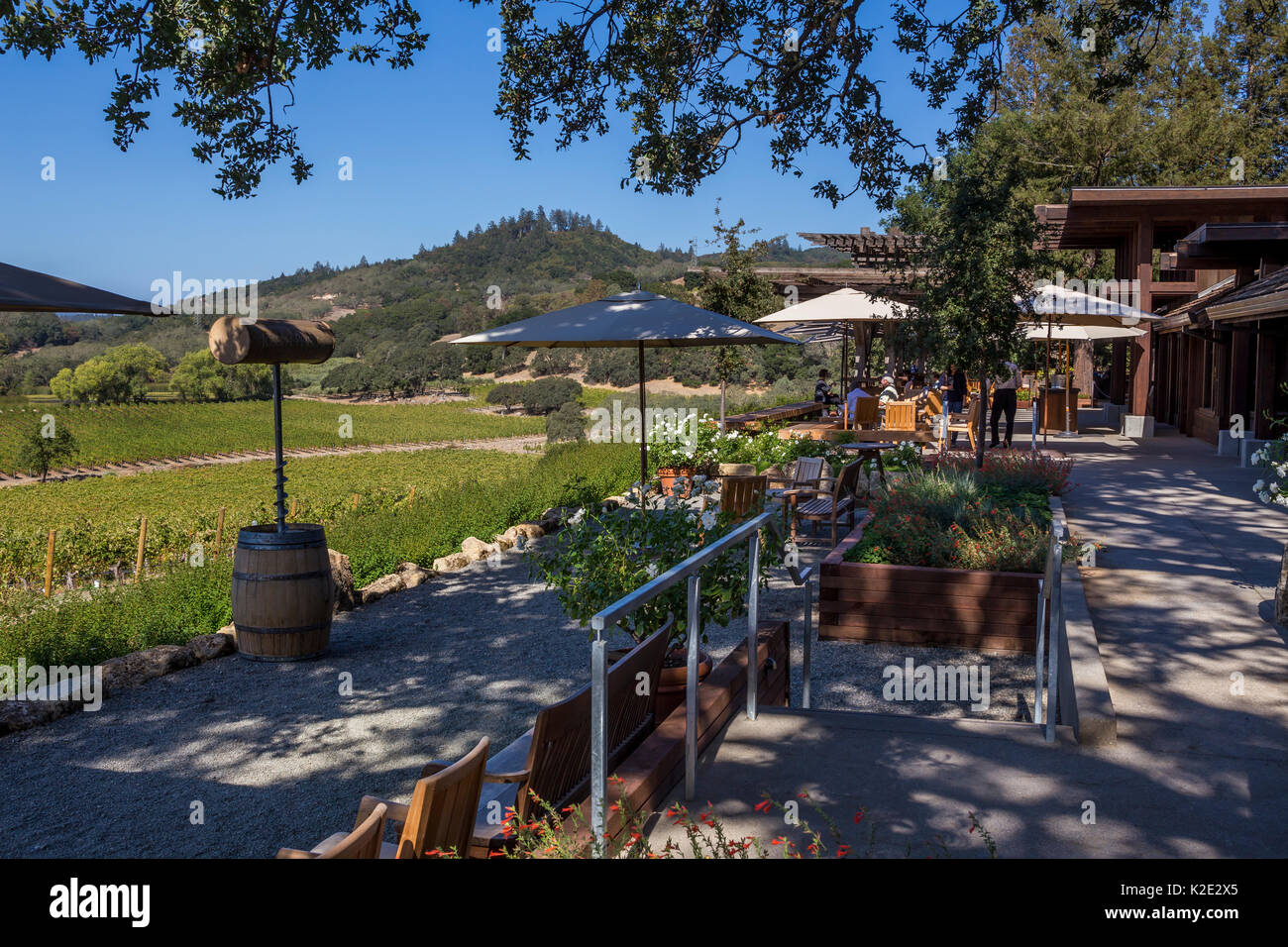 people, tourists, wine tasting, seated wine tasting, outdoor terrace, tasting room, Joseph Phelps Vineyards, Saint Helena, Napa Valley, California Stock Photo