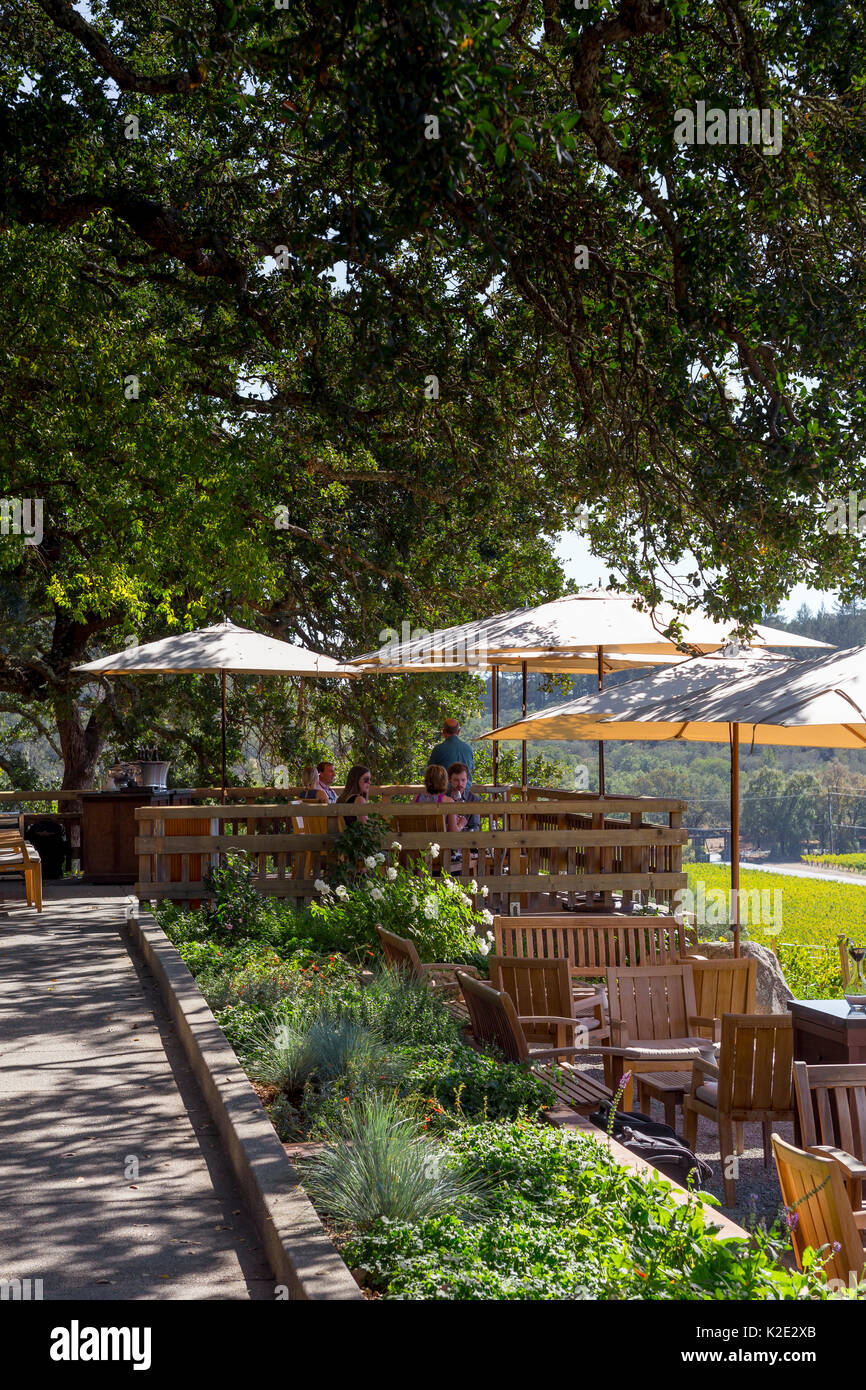 people, tourists, wine tasting, seated wine tasting, outdoor terrace, tasting room, Joseph Phelps Vineyards, Saint Helena, Napa Valley, California Stock Photo