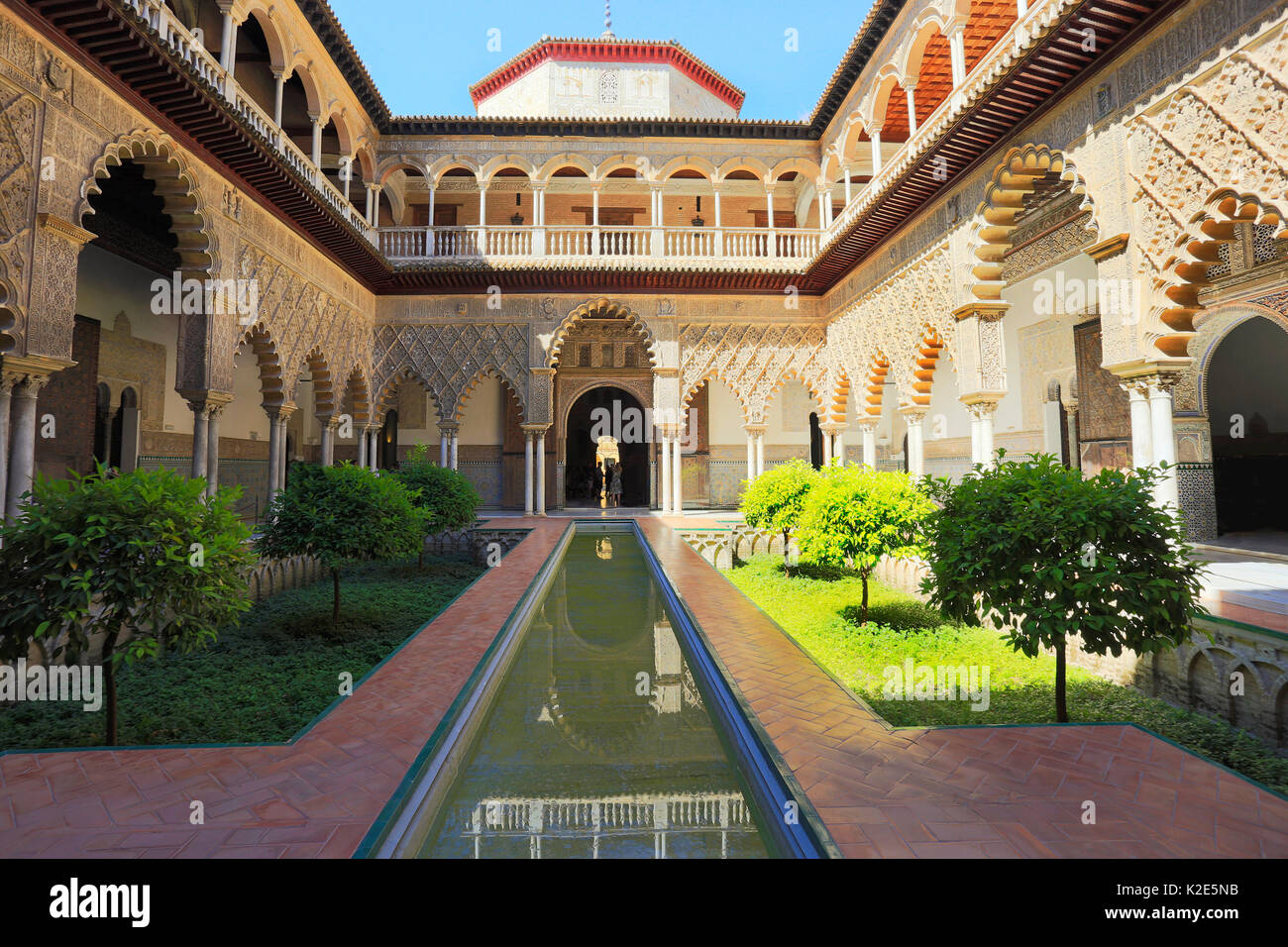 Palace of Alcazar, Famous Andalusian Architecture. Old Arab Palace in Seville, Spain. Moorish Ornamented Arches, fountain and Columns Stock Photo