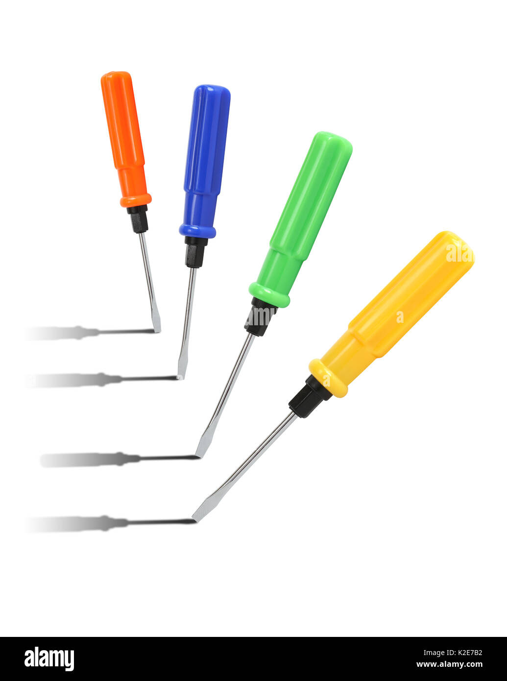 Few screwdrivers with color plastic handles standing in a row on white ...