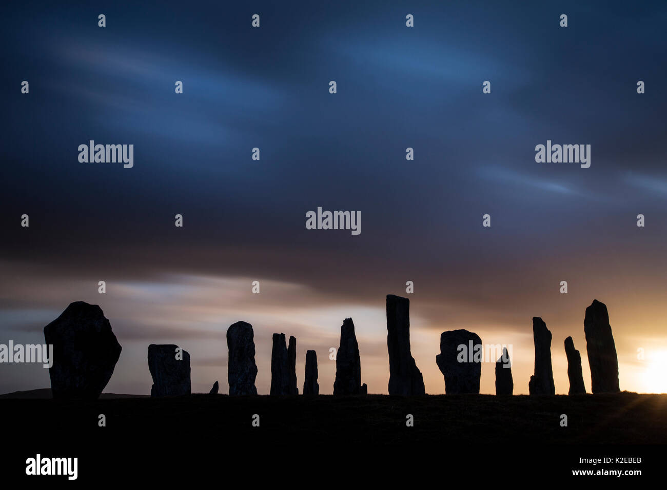 Callanish Stones silhouetted at dawn, Isle of Lewis, Outer Hebrides, Scotland, UK, April 2014. Stock Photo