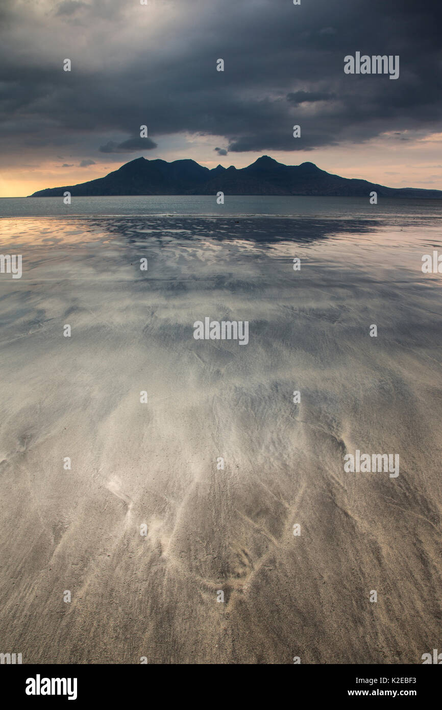 Sunset over Bay of Laig, Isle of Eigg towards Isle of Rum, Inner Hebrides, Scotland, UK, April 2014. Stock Photo