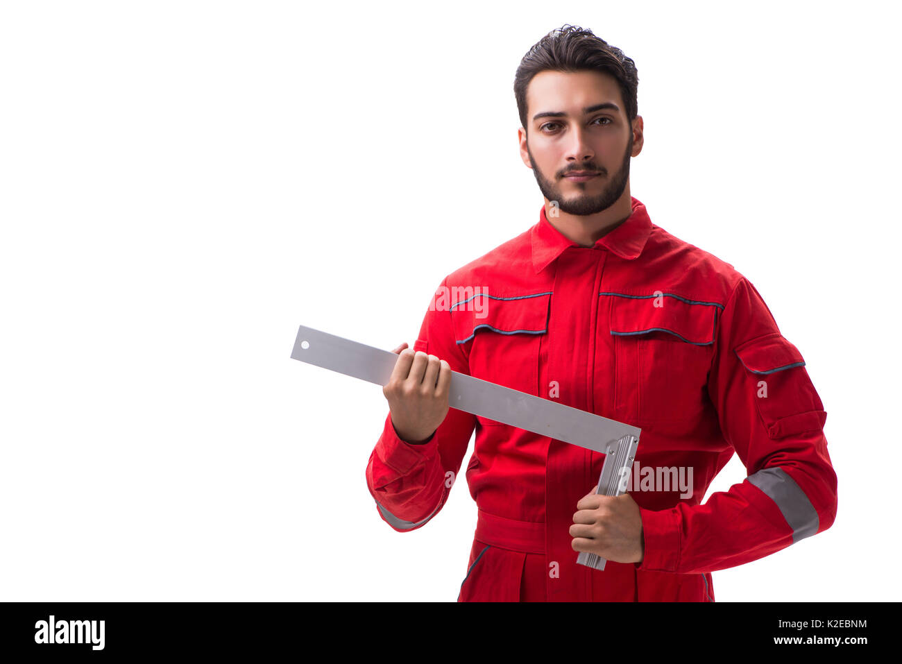 Young repairman with a square ruler isolated on white background Stock ...