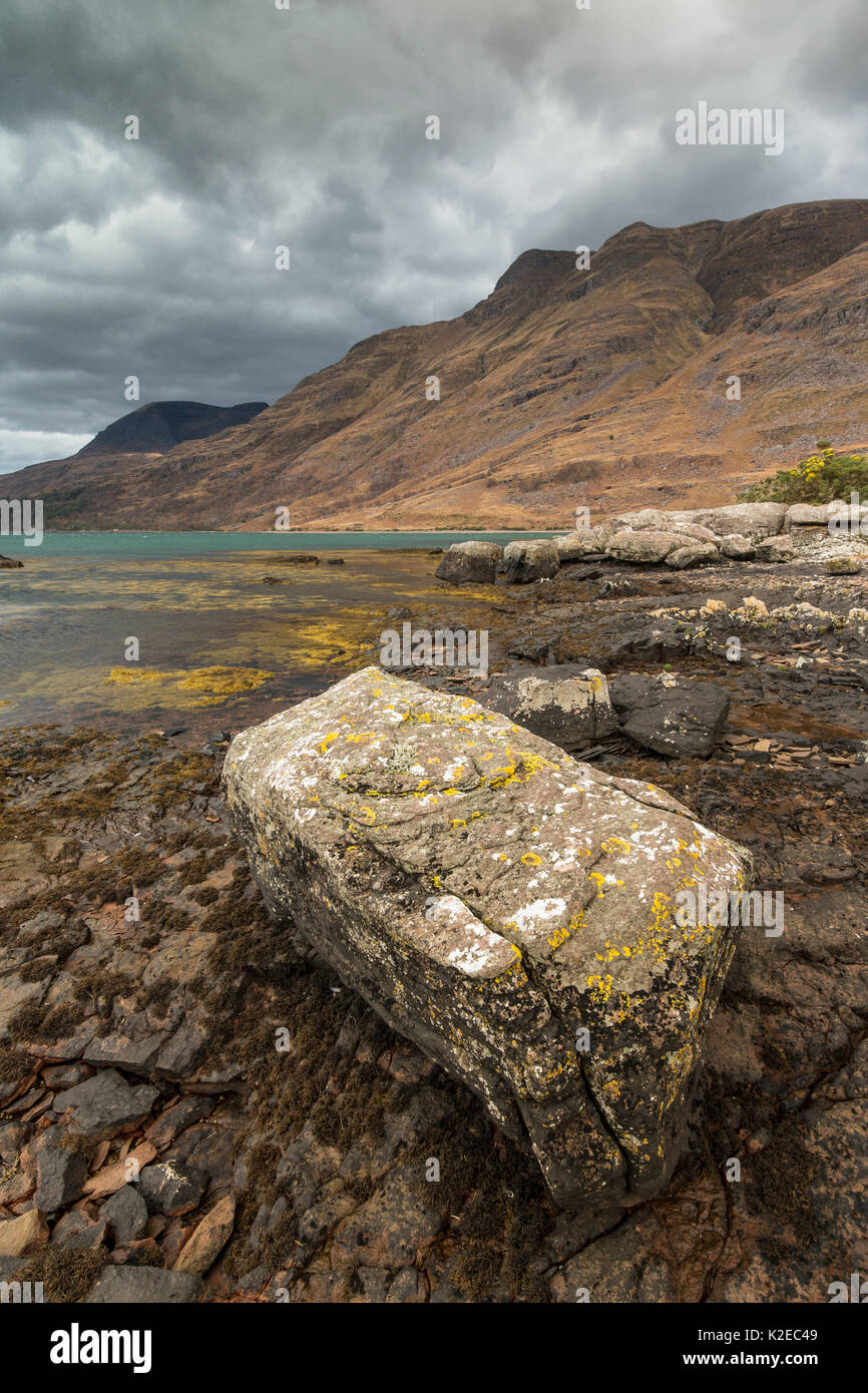 Rocky foreshore of Loch Torridon looking up to Sgorr a Chadail, Wester Ross, Scotland, November 2014. Stock Photo