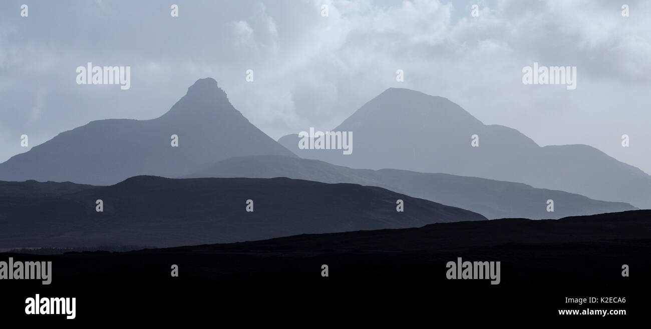Silhouettes of hills including Stac Pollaidh and Cul Beag, Assynt, Sutherland, Scotland, UK, February 2015 Stock Photo
