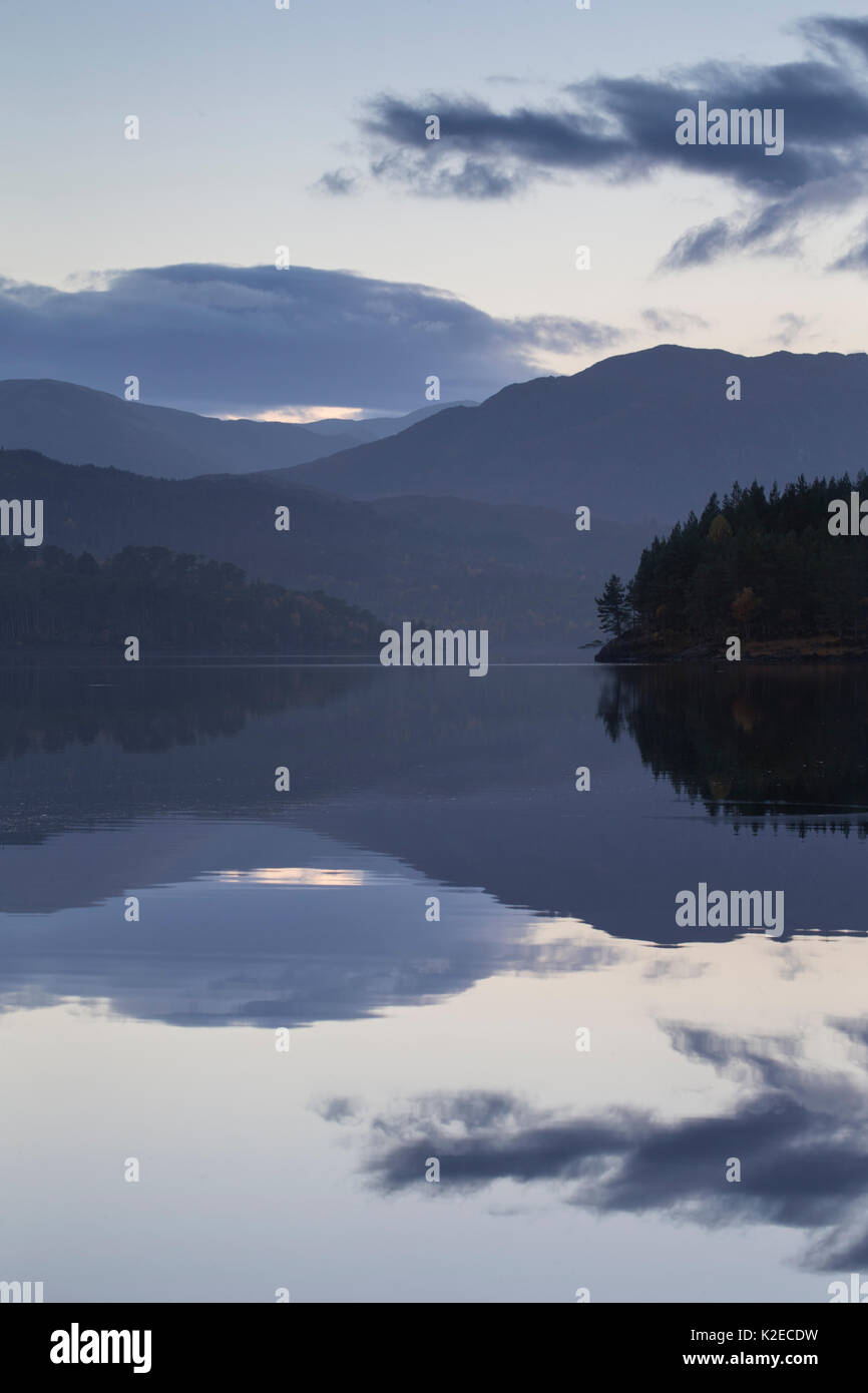 Reflections at twilight along Loch Beinn a Mheadhoin, Glen Affric National Nature Reserve, Highland, Scotland, October 2015. Stock Photo