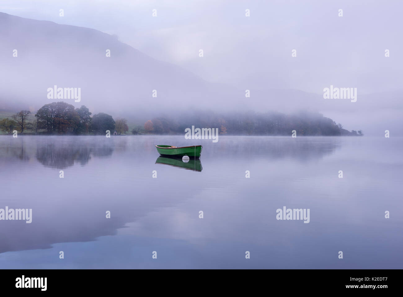 Rowing boat on Ullswater in early morning mist, Lake District, Cumbria