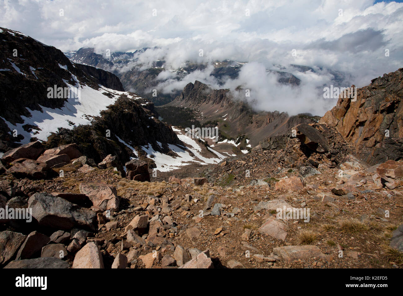 Snow covered mountains and low cloud from the Bear Tooth Pass Wyoming USA June 2015 Stock Photo