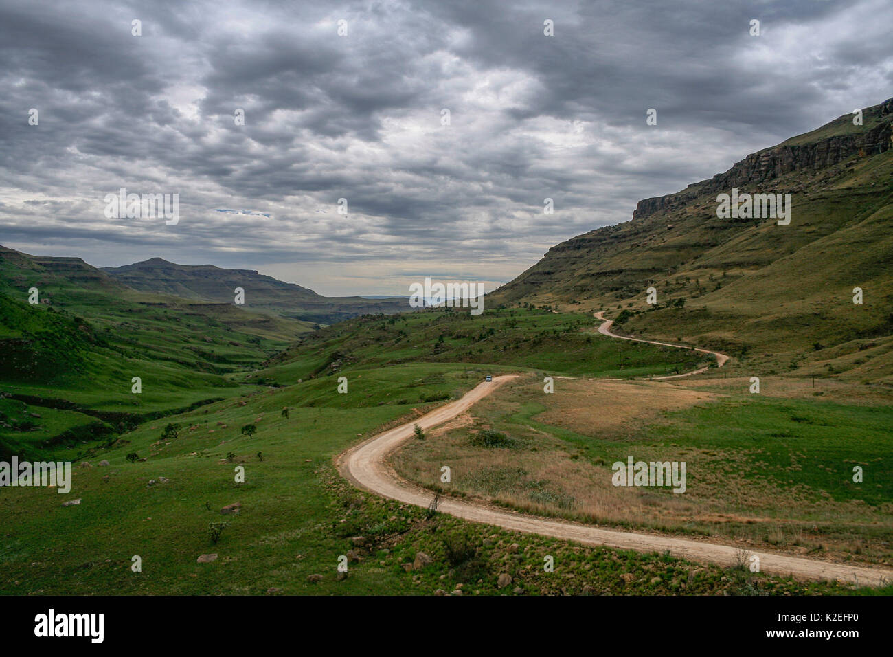 Winding road leading through the Sani Pass. Drakensberg Mountains from ...