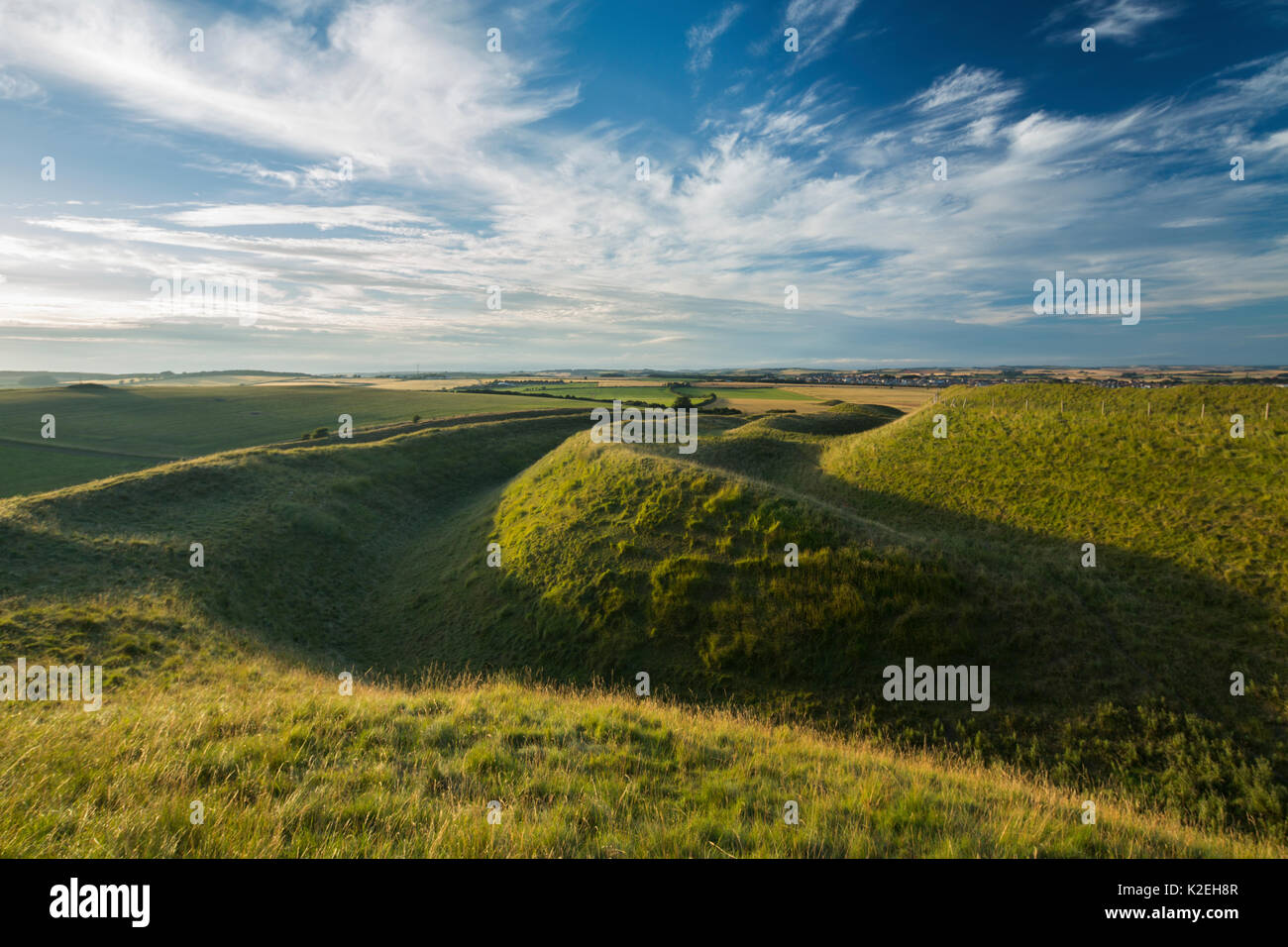 Western ramparts of Maiden Castle, an Iron Age hill fort near Dorchester, Dorset, England, UK, July. Stock Photo