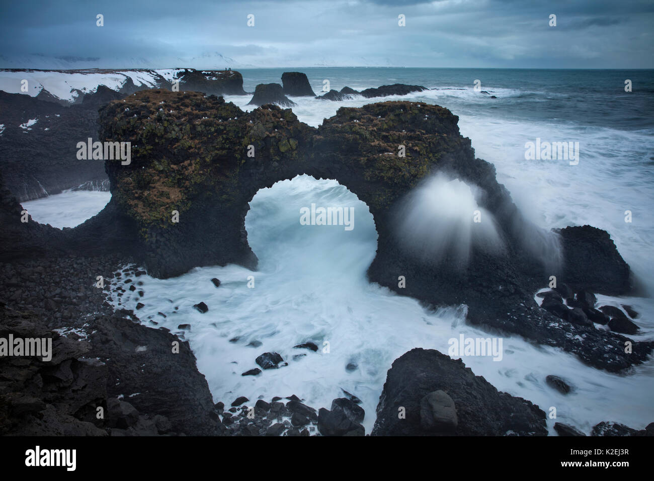 Winter storm on the coast near Arnastapi (rock arch of Gatklettur), Snaefellsness Peninsula, Iceland, February 2016. Stock Photo