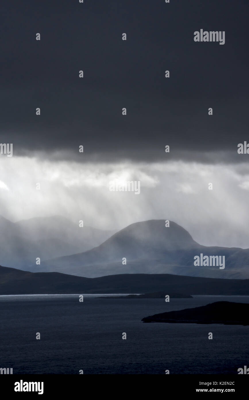 Stormy sky and downpour during rain storm over desolate wilderness of Coigach, Wester Ross in the Northwest Highlands of Scotland, UK, September 2016. Stock Photo