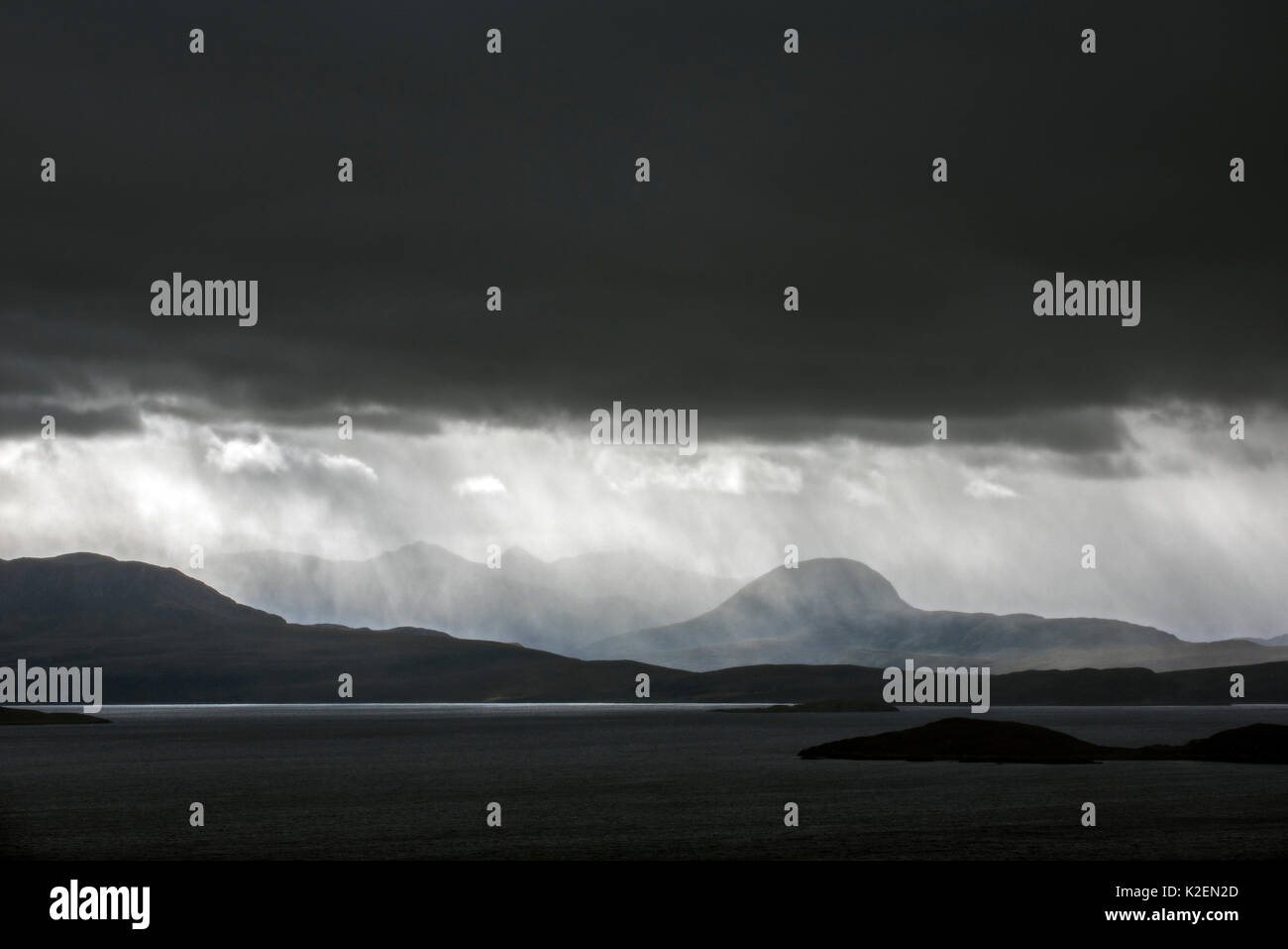 Stormy sky and downpour during rain storm over desolate wilderness of Coigach, Wester Ross in the Northwest Highlands of Scotland, UK, September 2016. Stock Photo