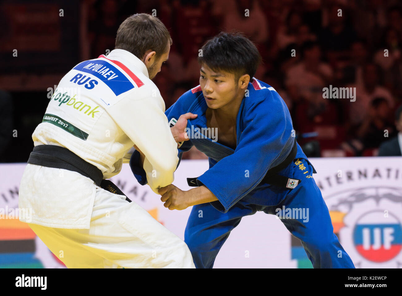 Budapest, Hungary. 29th Aug, 2017. Pauliaev Mikhail of Russia (white kimono)  and Abe Hifumi of Japan (blue kimono) during the fight in the -66kg  category at the Judo World Championship Budapest 2017