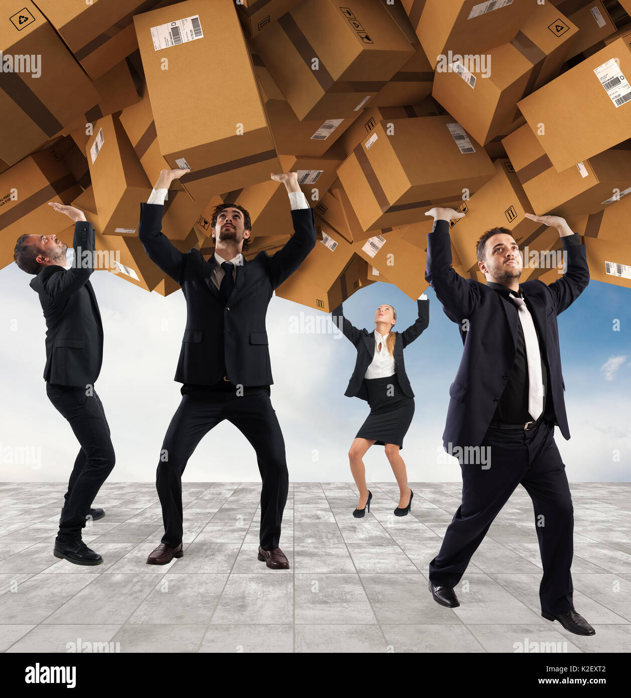 People buried by a stack of cardboard boxes. Concept of internet shopping addiction Stock Photo