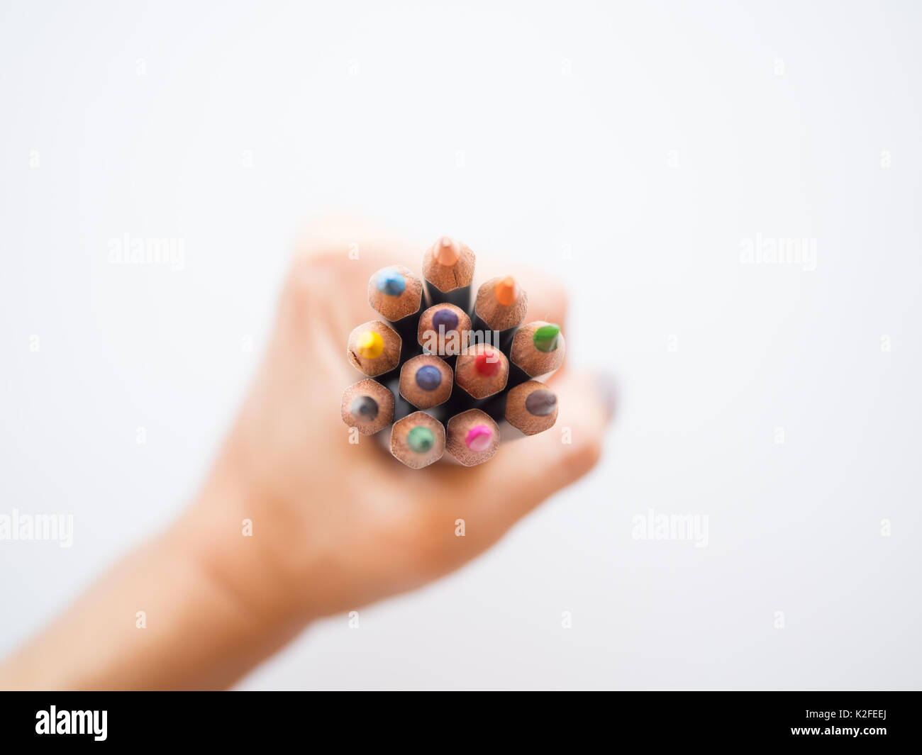 Hand Holding a set of Drawing Pencils, learning how to draw, art