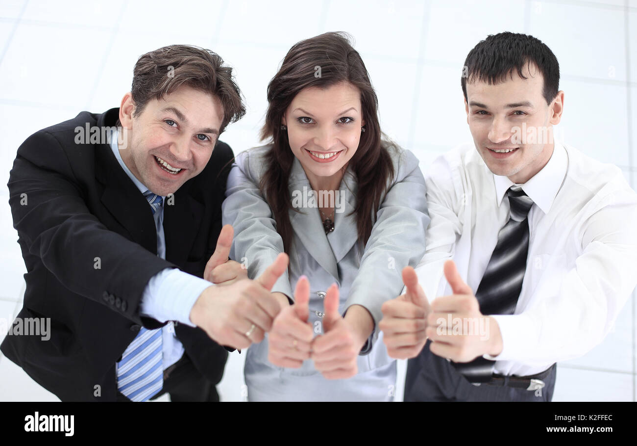 successful business team showing thumbs up Stock Photo - Alamy