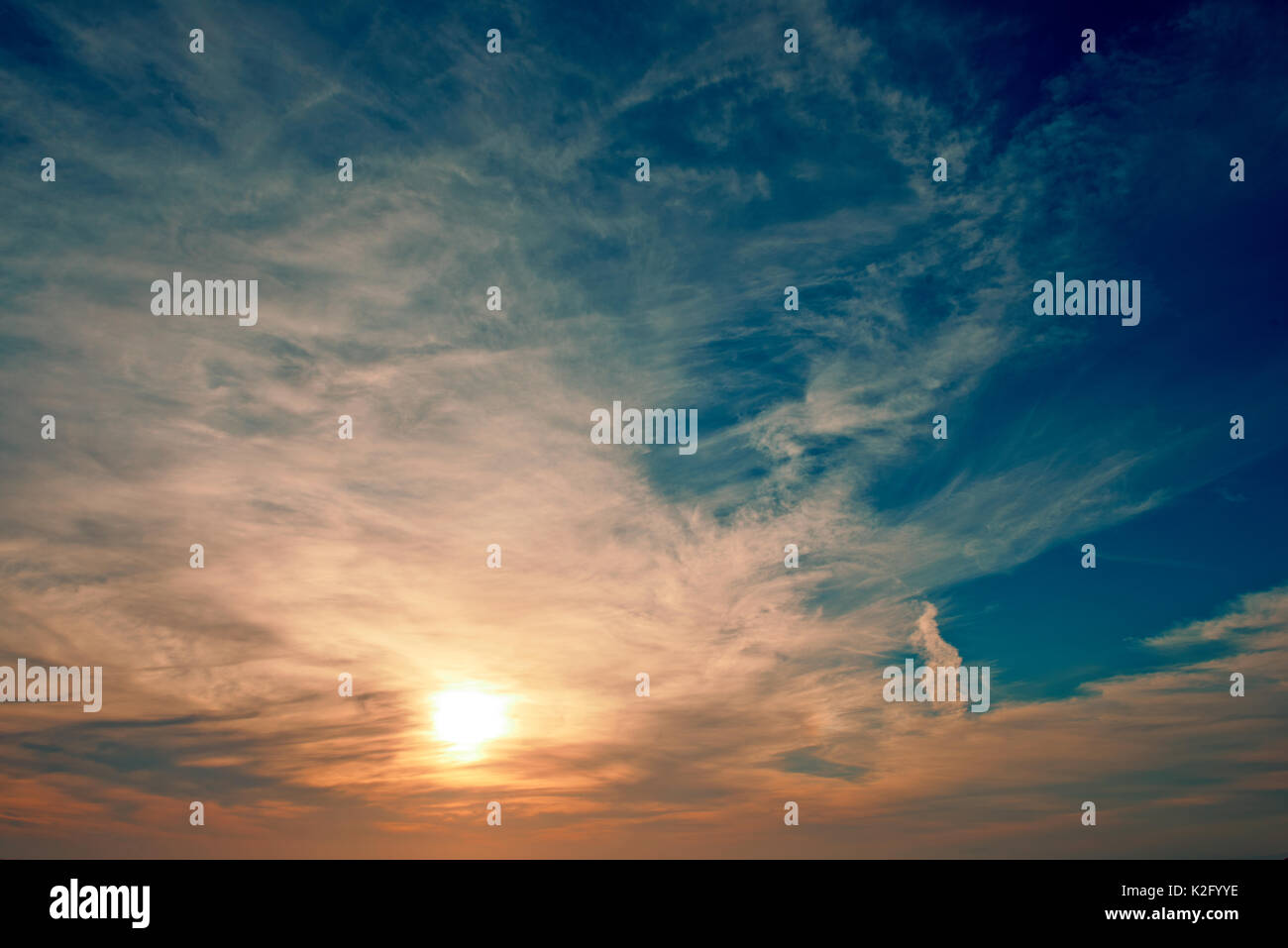 Sunset over water Stock Photo - Alamy