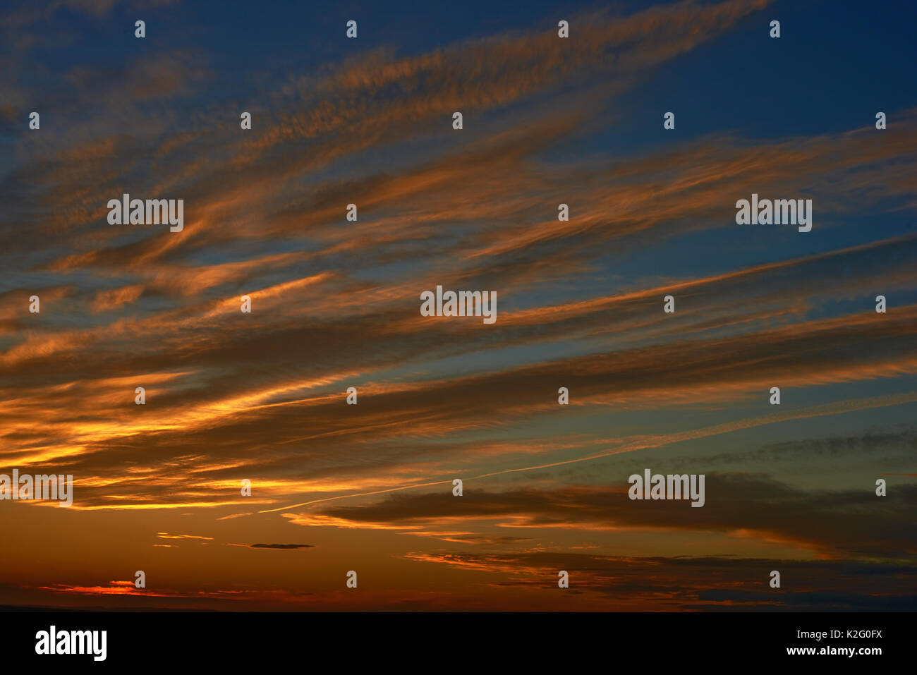 Sunset over water Stock Photo - Alamy