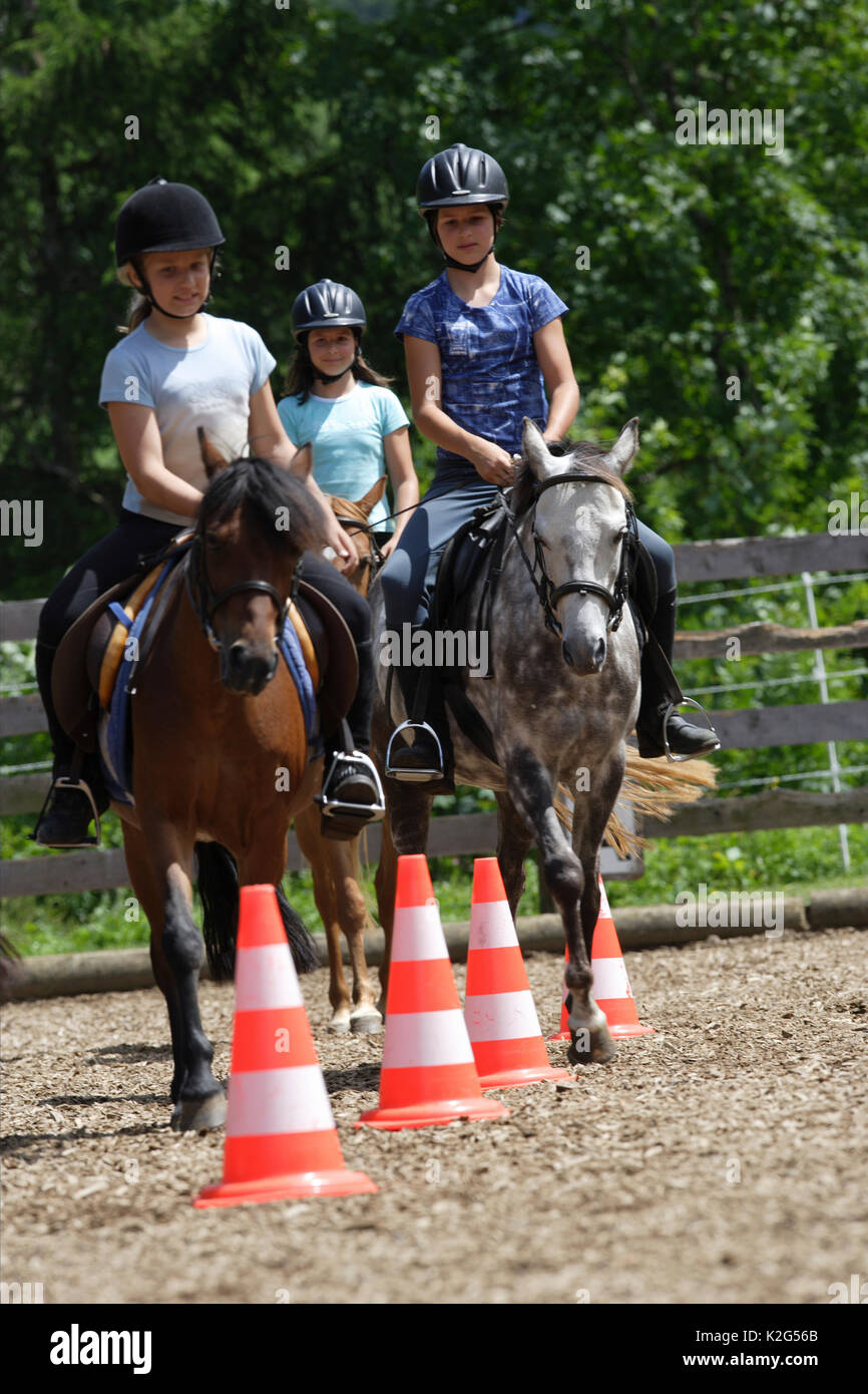 Horse riding around traffic cones hires stock photography and images