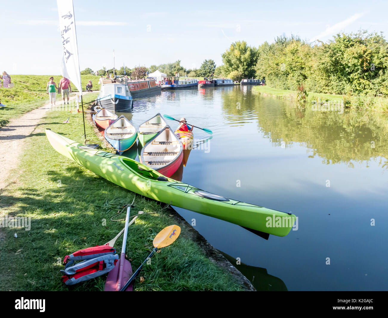 Colourful canoes moored  on the Grand Union Canal at Marsworth, in the Vale of Aylesbury, Bucks Stock Photo