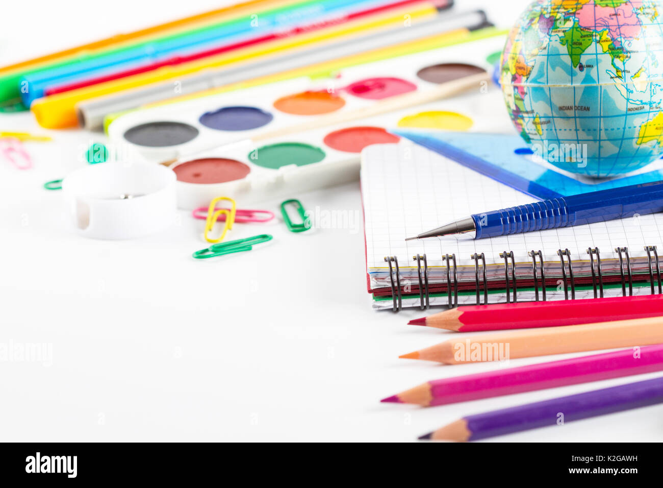 Assortment of school supplies on white background Stock Photo - Alamy
