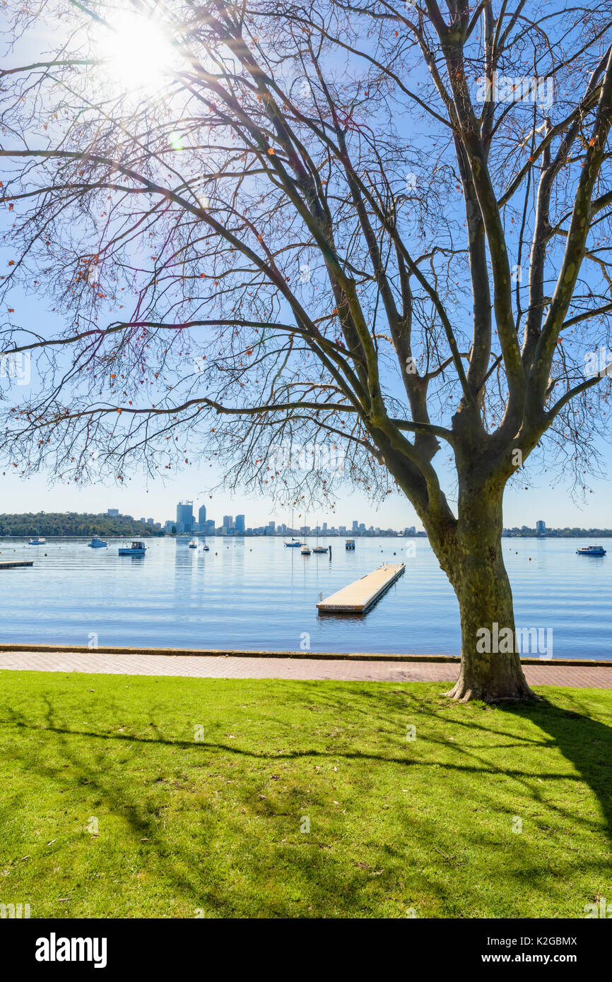 Winter sun over Matilda Bay viewed from the foreshore of the Swan River, at Crawley, Perth, Western Australia Stock Photo