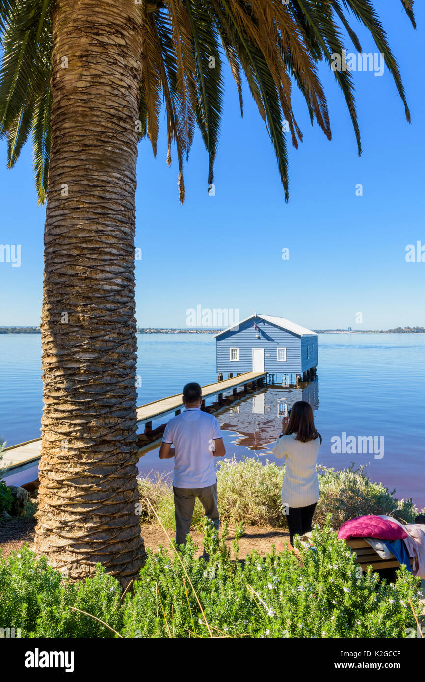 Tourists taking photos of the iconic Crawley Edge Boatshed or Blue Boat House on the Swan River in Matilda Bay, Crawley, Perth, Western Australia Stock Photo