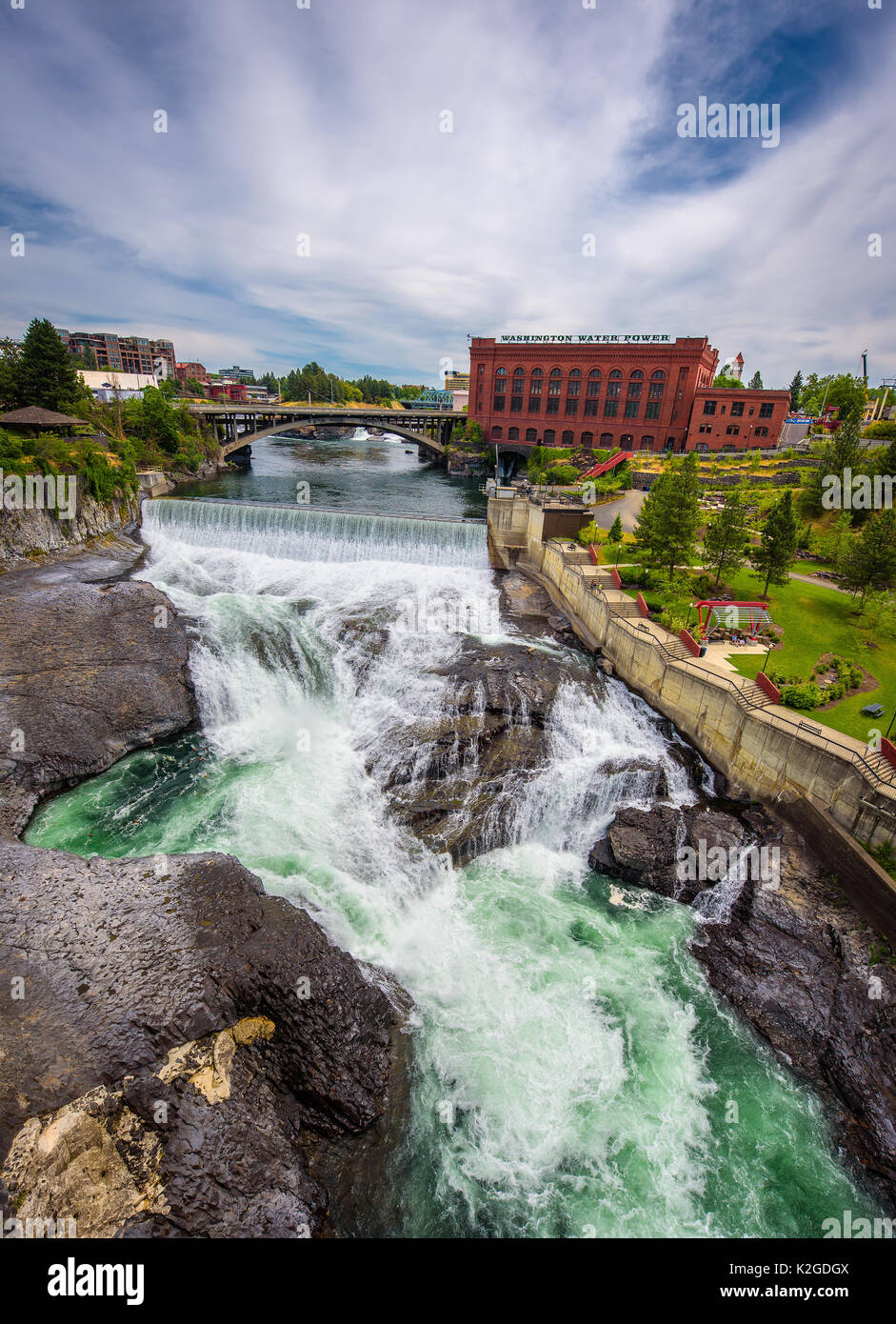 Falls and the Washington Water Power building along the Spokane river viewed from the Monroe Street Bridge. Stock Photo