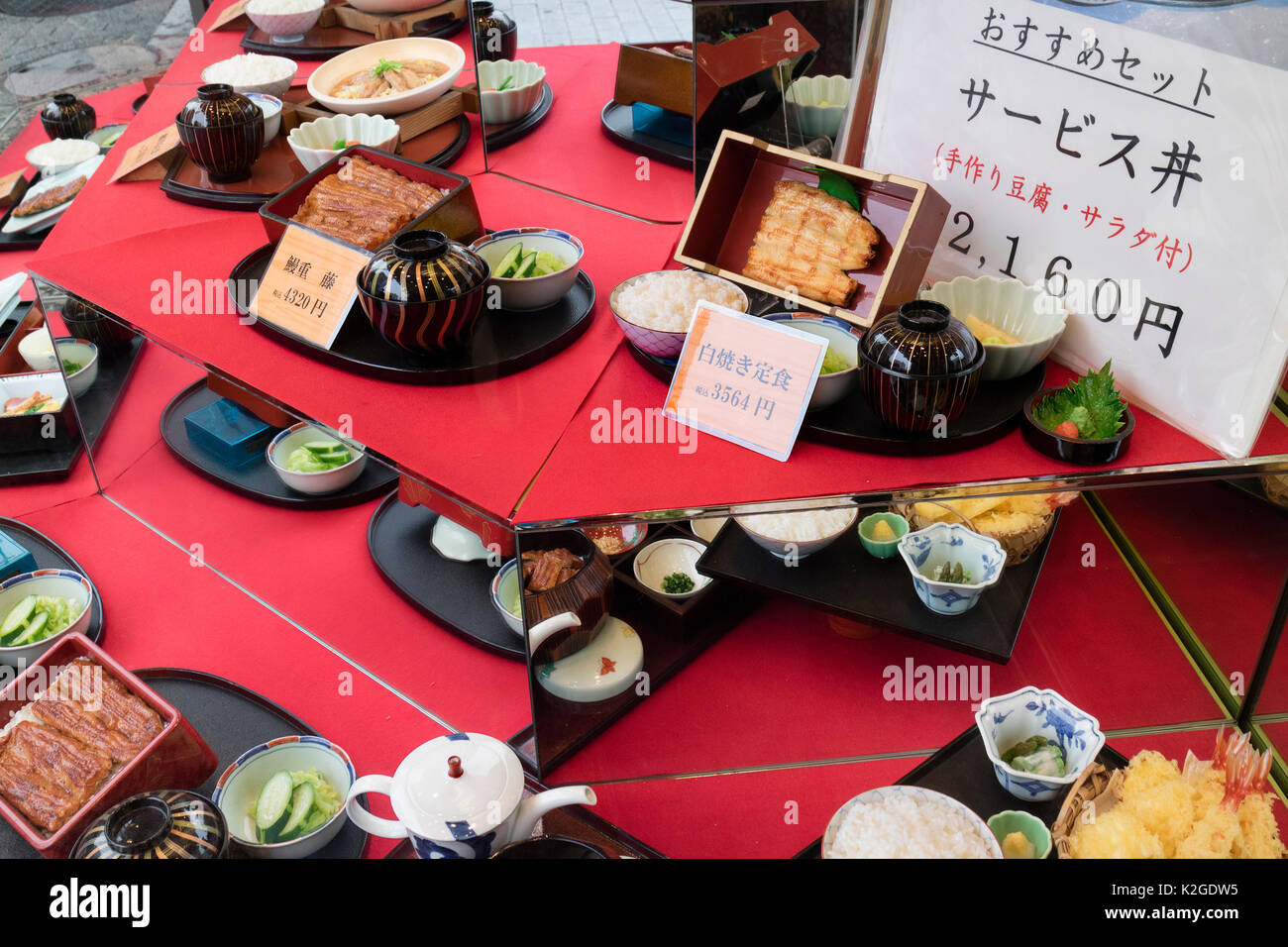 Tokyo, Japan - May 12, 2017:  Display of replica food outdoors in front of a restaurantDisplay of replica sweets en desserts outdoors in front of a re Stock Photo