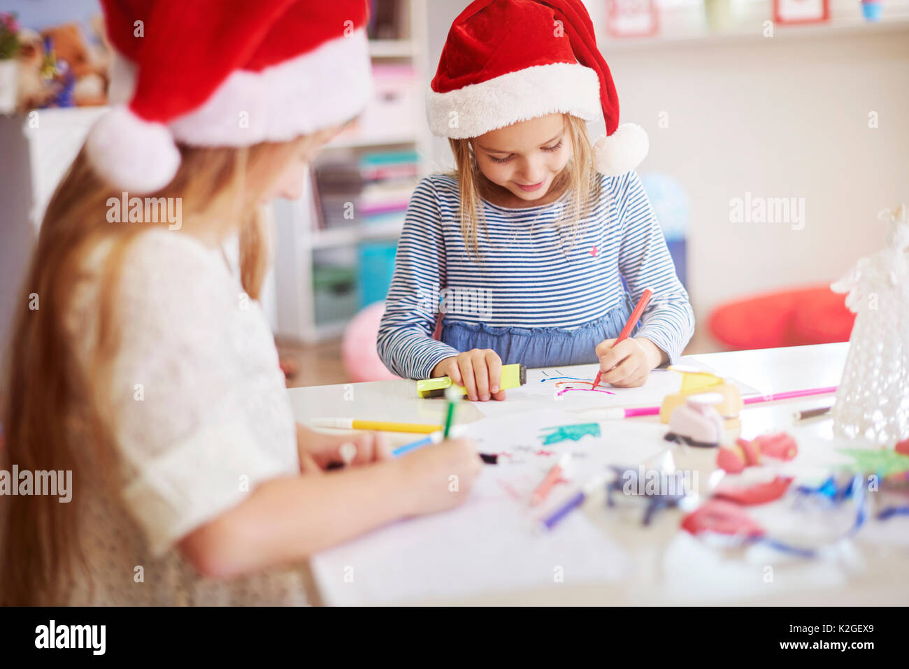 Children drawing some christmas paintings Stock Photo